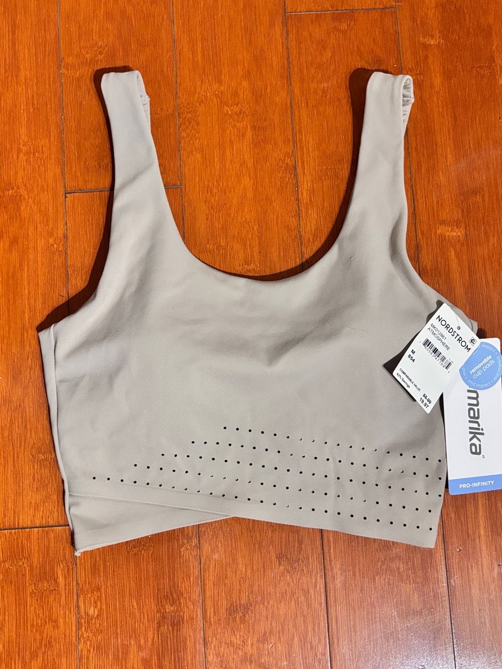 Marika M tan sports bra with perforated panel on the lower front